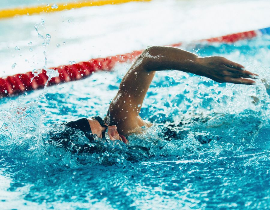 Freestyle swimming competitor in a indoor pool