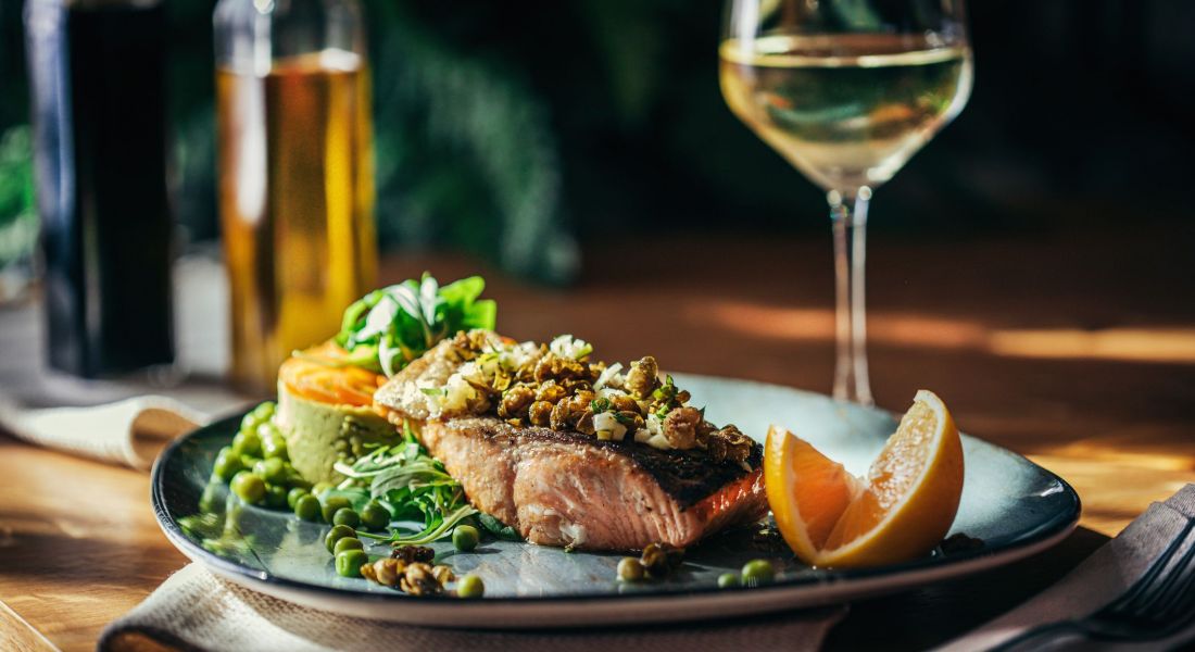 Barbecued salmon and vegetables on plate