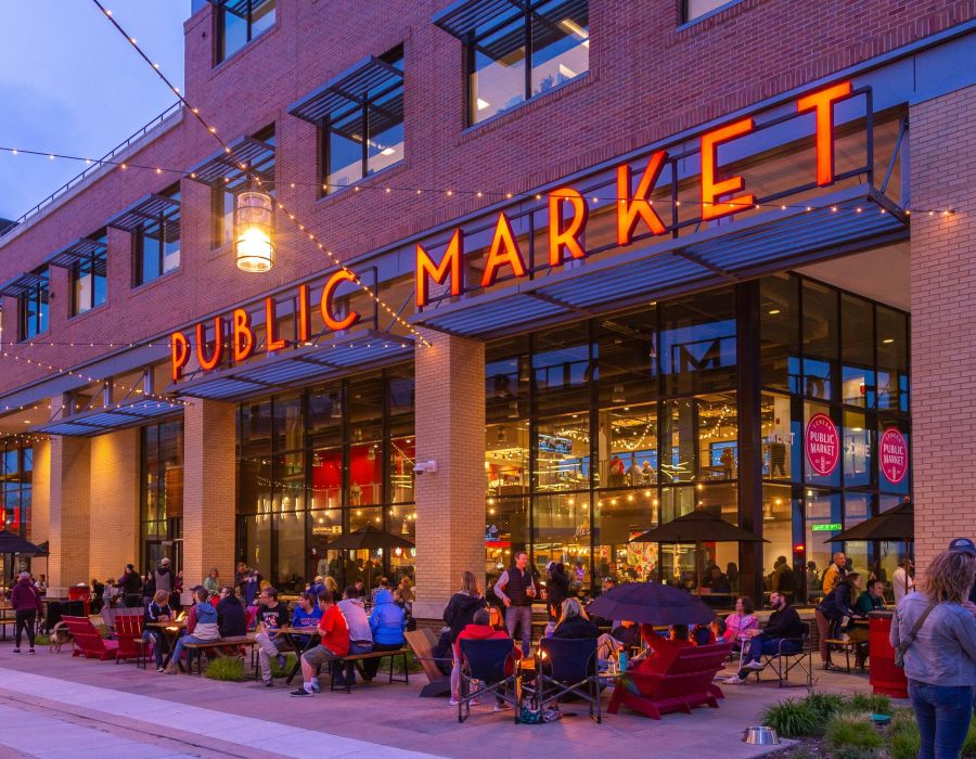 Public Market signage at dusk with outdoor seating